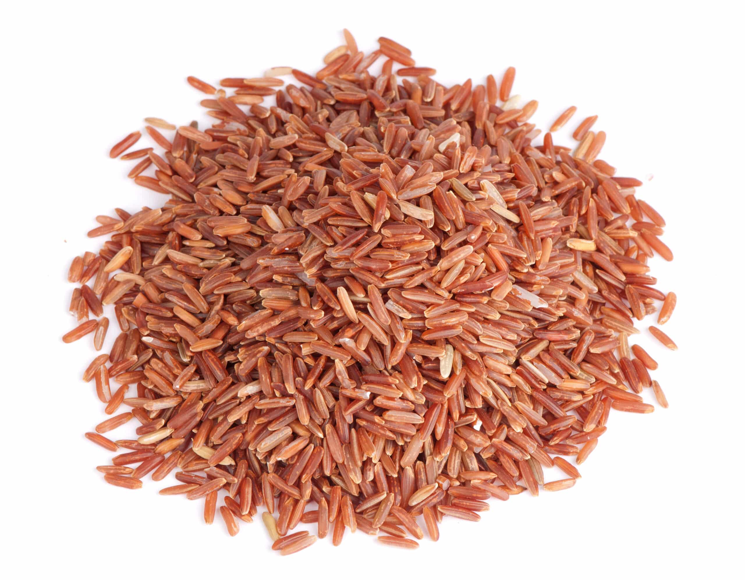 Pile of red rice grains scattered on a white background.