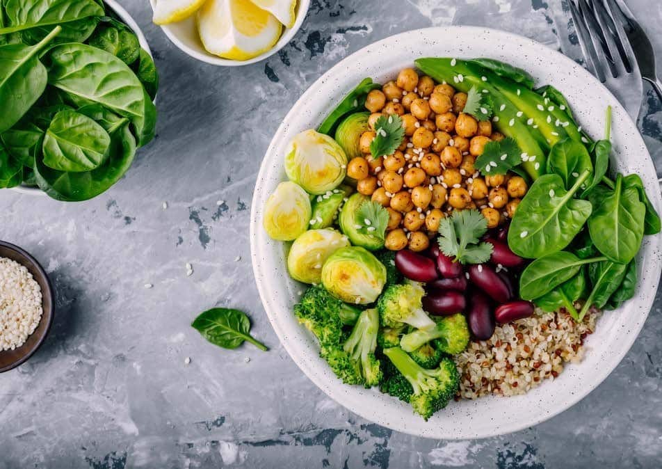 Bowl of quinoa, chickpeas, kidney beans and greens